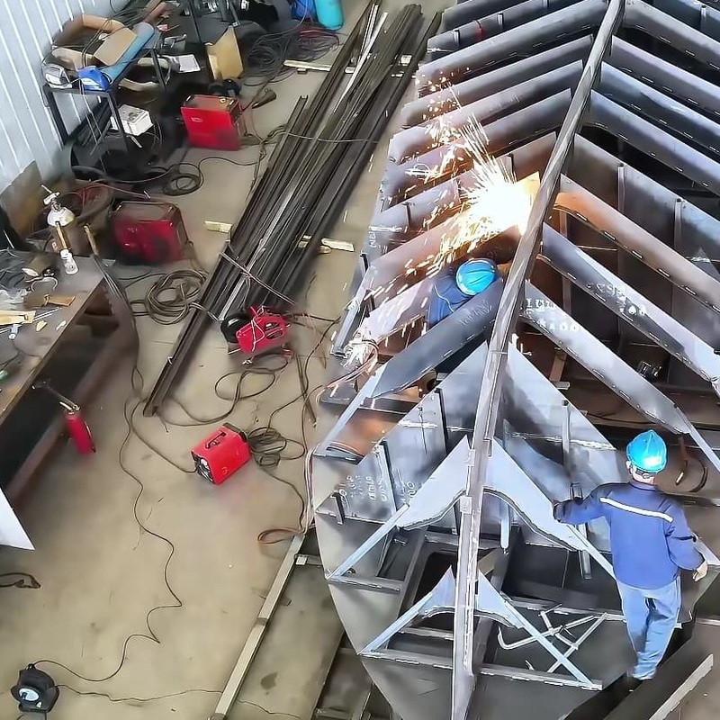 Steel hull frames being welded in the workshop