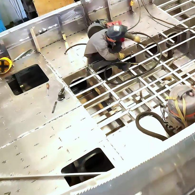 Aluminum hull frames and deck plating under construction in the workshop